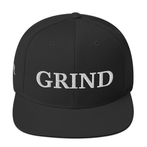 black "grind" snapback hat with white letters 