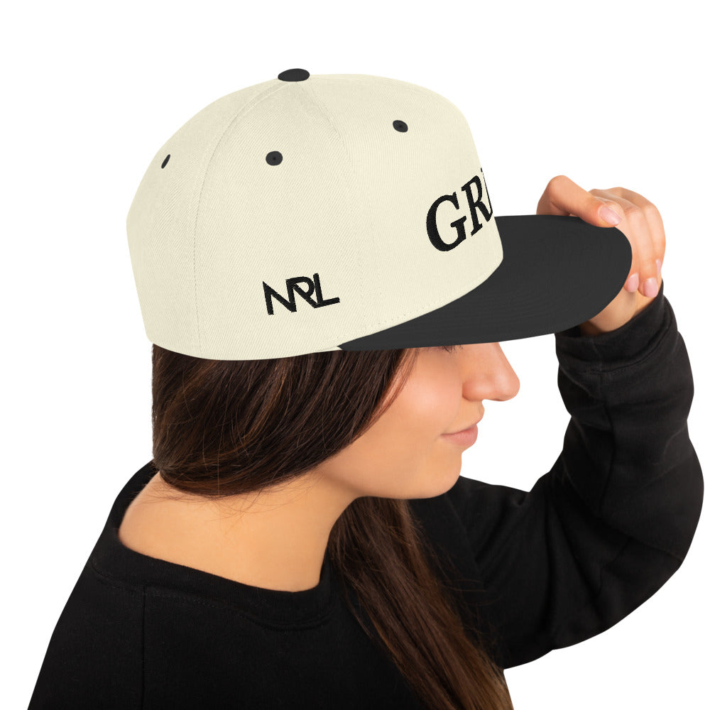 natural "grind" snapback hat with black letters  and black brim