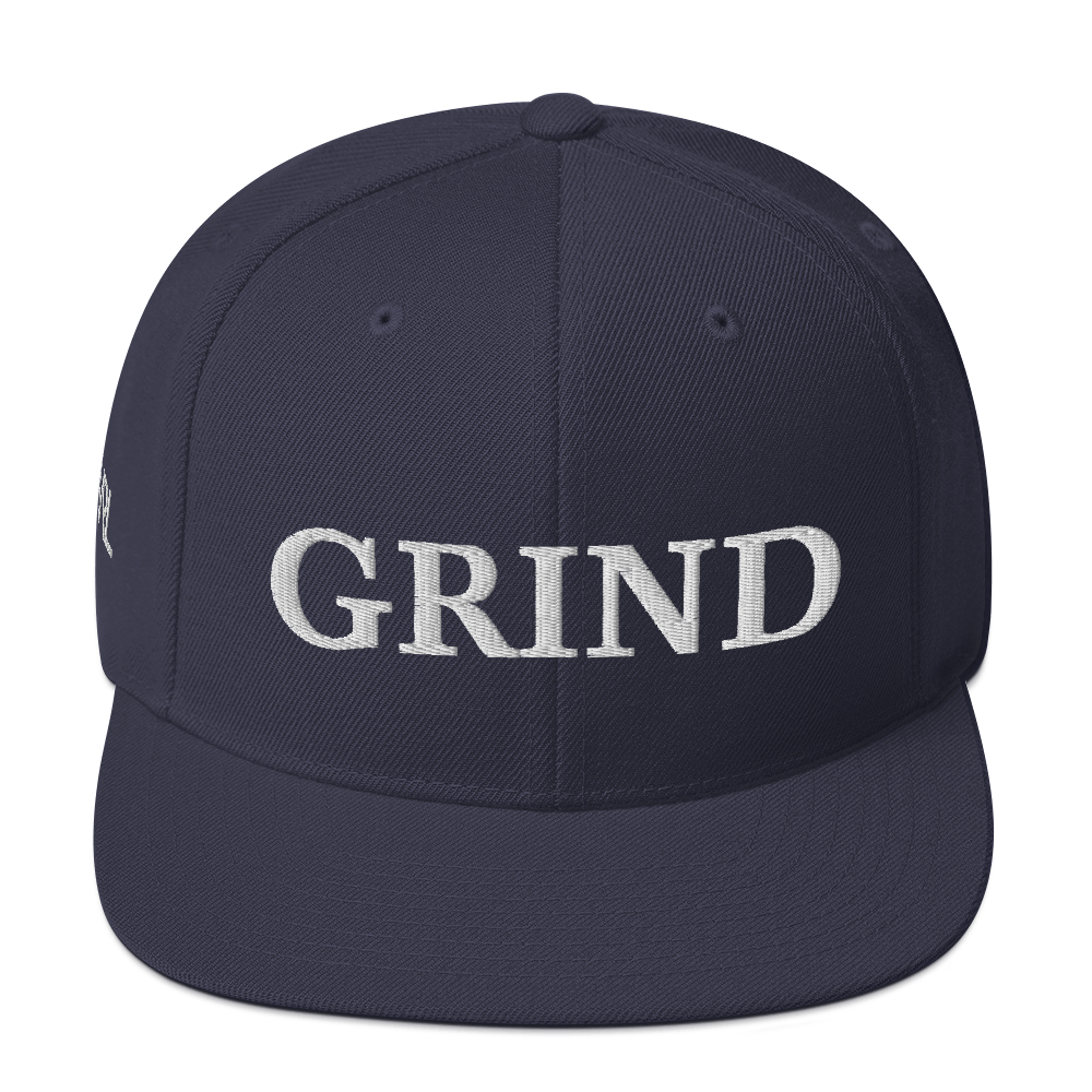 Navy blue "grind" snapback hat with white letters