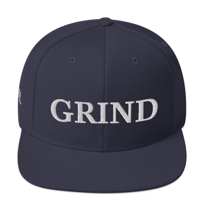 Navy blue "grind" snapback hat with white letters