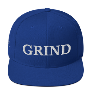 royal blue "grind" snapback hat with white letters